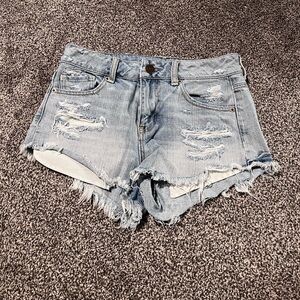 Light wash distressed AE shorts